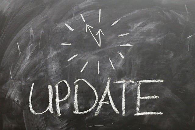 Chalkboard with the word UPDATE and a clock drawn in chalk